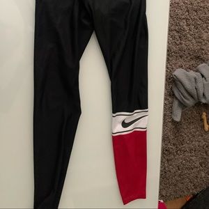 Nike luxe leggings with one leg red